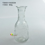 Glass milk bottle with emobossed friut design